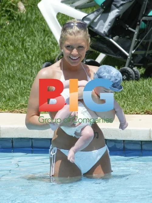 Suzanne Shaw Relaxes with Child in Pool
