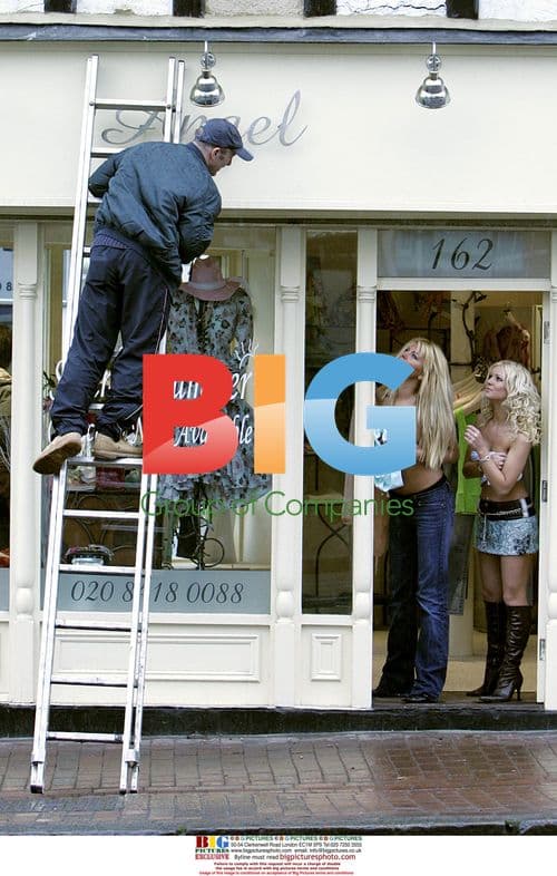 Leah Newman and Charlene Hart try on clothing