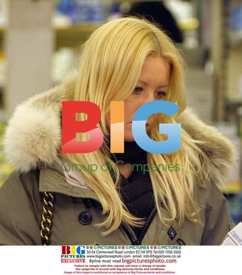 Denise Van Outen shops in gloomy mood