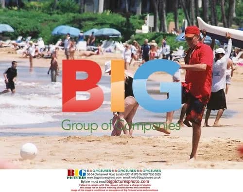 Rod Stewart playing with family on Hawaii beach