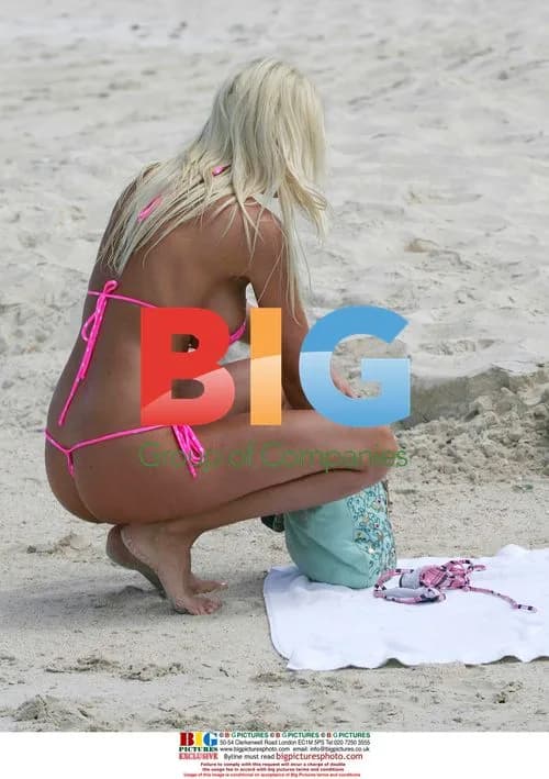Model Emma B plays in the sea