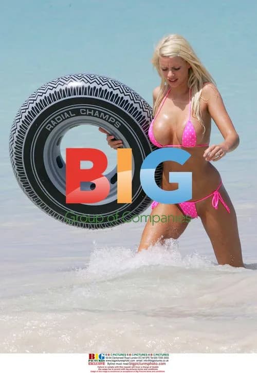 Model Emma B plays in the sea with inflatable ring