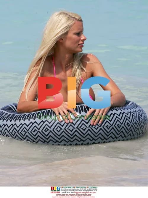 Emma B plays in the sea with rubber ring