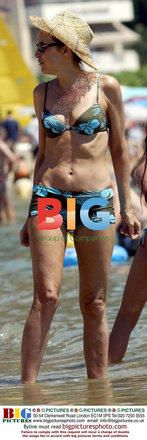 Jerry Hall Relaxing on Beach with Family