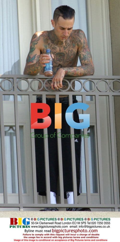 Travis Barker Photographs During Divorce