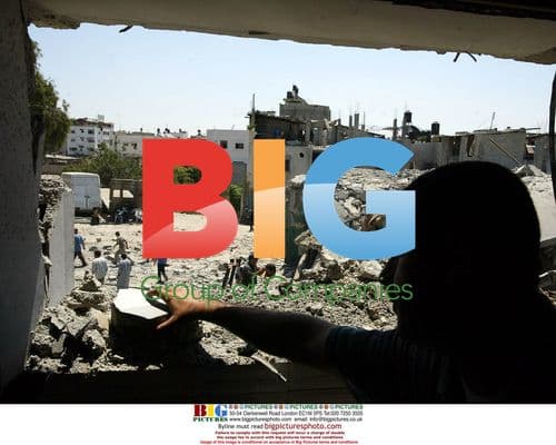 Palestinians search rubble of destroyed Gaza home