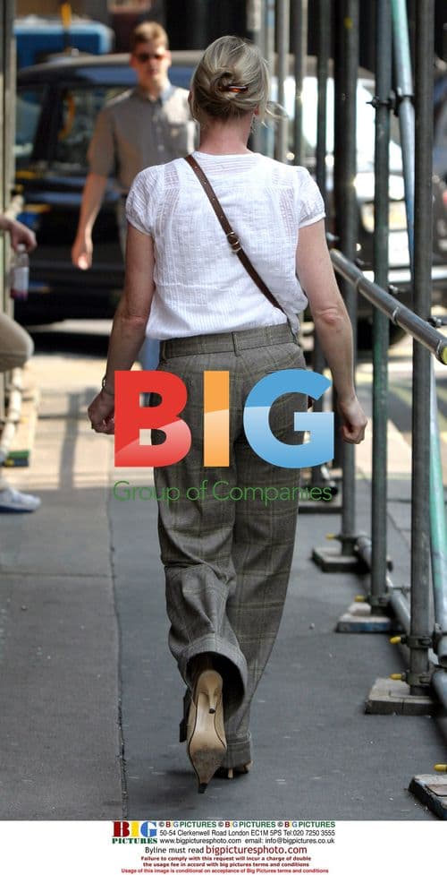 Sarah Lancashire hails taxi in London