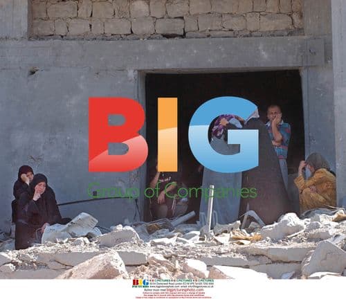 Family hugs after returning to damaged homes in Srifa, Lebanon