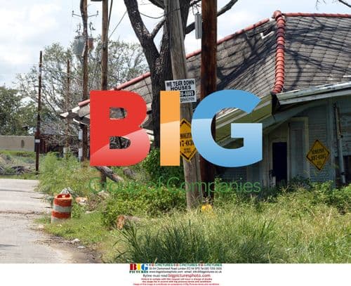 Abandoned house stuck in tree after Hurricane Katrina