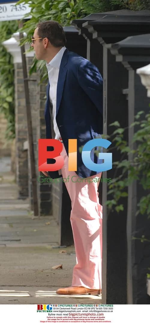 David Walliams leaves home in pink trousers