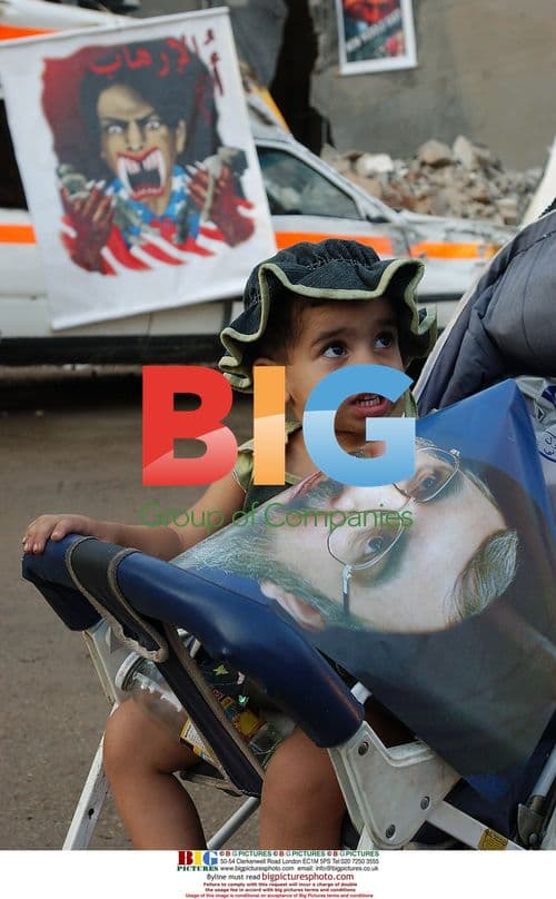 Boy Holds Hezbollah Poster in Beirut