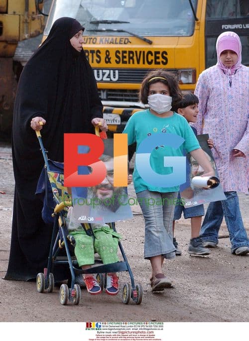 Young Boy Holds Hezbollah Poster in Beirut