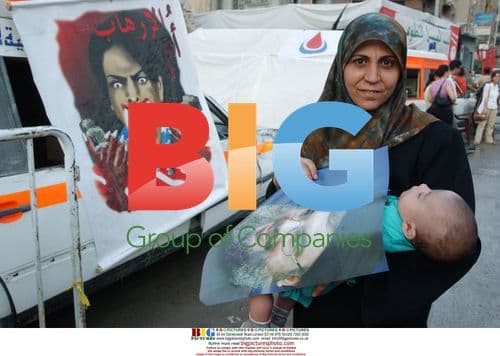 Mother and boy with Nasrallah poster in Beirut