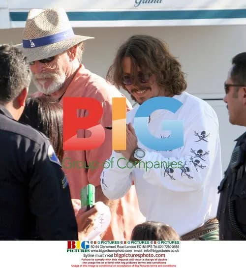 Johnny Depp signing autographs on Pirates set