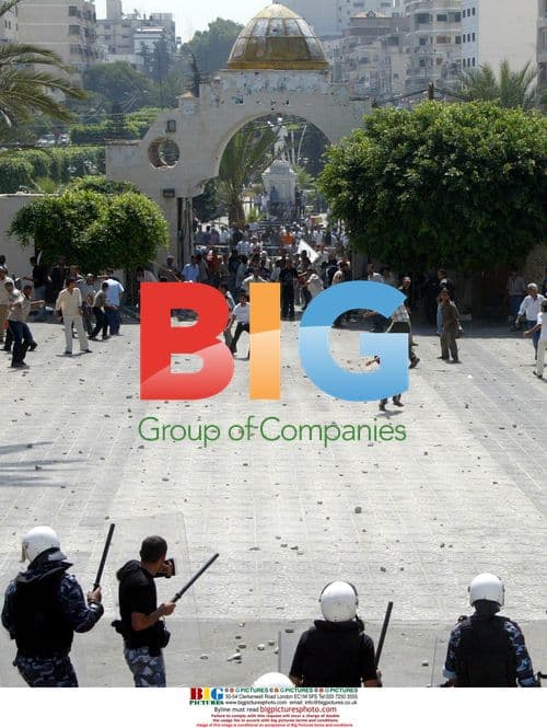 Palestinian riot police clash with protesters in Gaza City