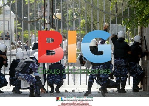 Palestinian riot police clash with unemployed workers in Gaza