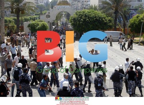 Palestinian riot police clash with workers during protest