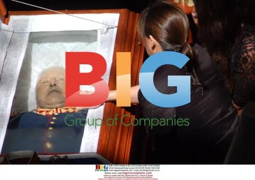 Supporter touches Pinochet's coffin