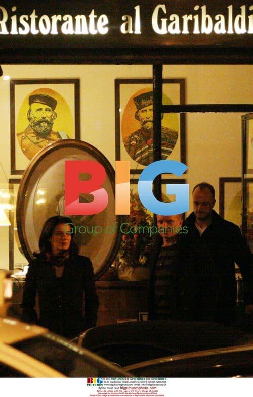 Sting leaving restaurant with mystery lady