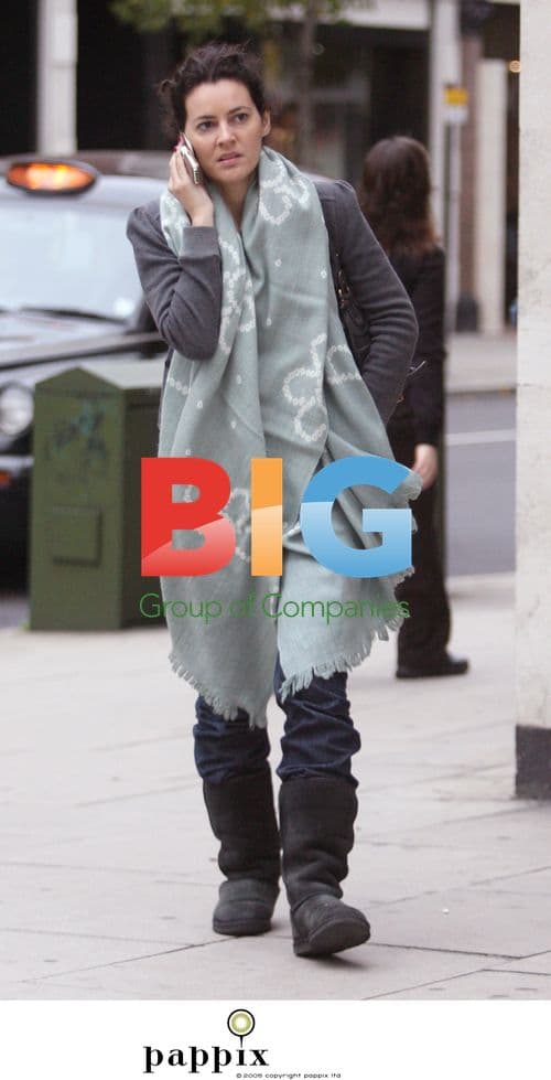 Actress Louise Delamere chats on phone in London