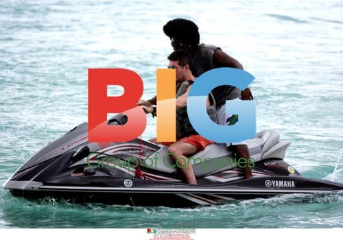 Simon Cowell rides jet ski on holiday