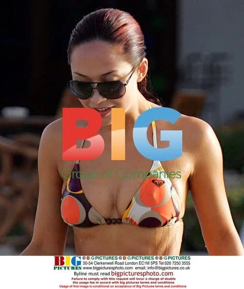 Myleene Klass relaxes poolside in Caribbean