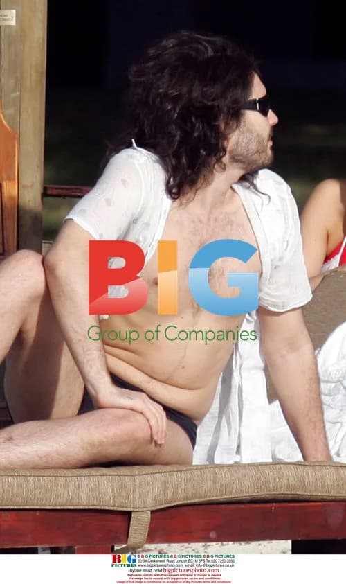 Russell Brand with mystery woman and mother on beach