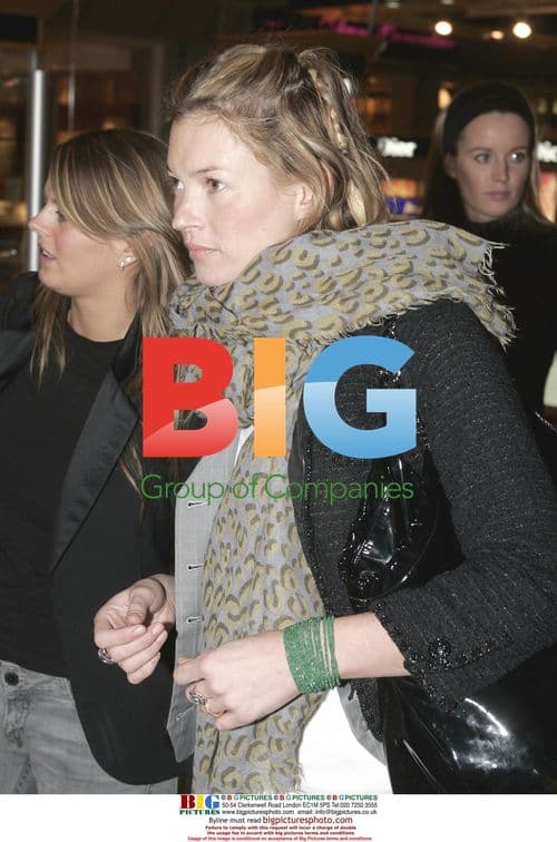 Kate Moss departs Heathrow