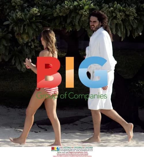 Russell Brand with mystery lady and mum on beach