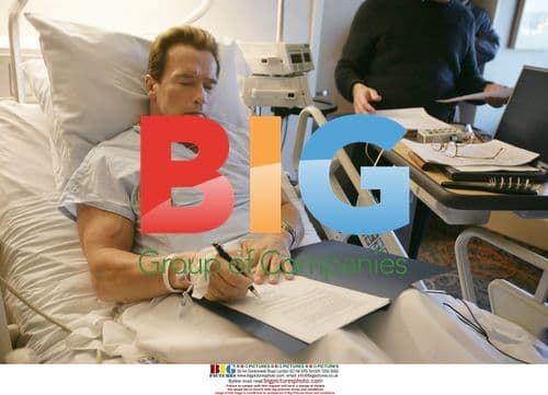 Arnold Schwarzenegger works from hospital bed