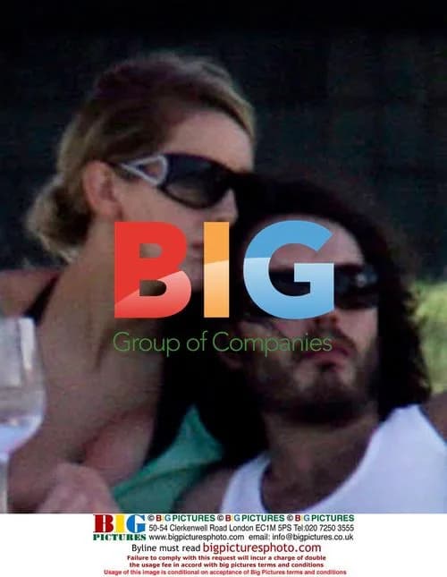 Russell Brand and mystery lady at beach