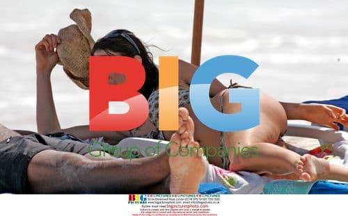 George Clooney's ex sunbathes with new beau