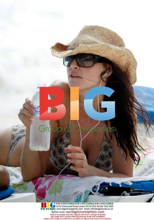 George Clooney's ex and new beau sunbathe in Caribbean