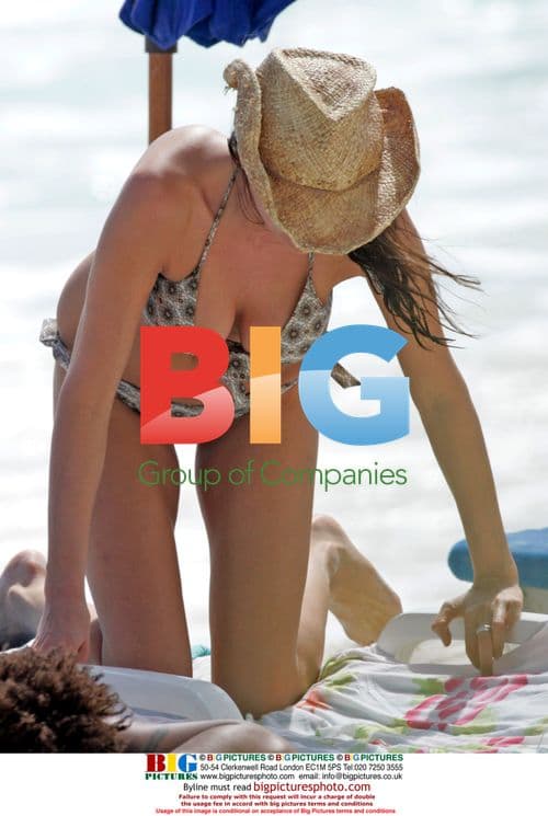 George Clooney's ex and new beau sunbathe in Caribbean