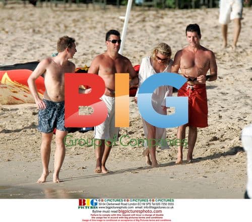 Simon Cowell Celebrates X-Factor Win in Caribbean