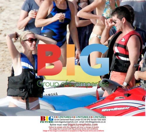 Simon Cowell celebrates X-Factor win in Caribbean