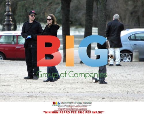 Brad Pitt, Angelina Jolie, and Maddox play with RC cars