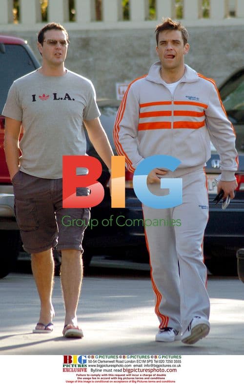 Robbie Williams Goofs Around with Friends