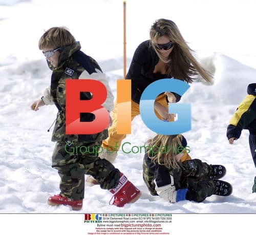 Victoria Beckham and Son Romeo Play in the Snow