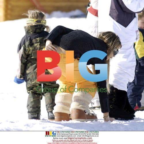 Victoria Beckham and son Romeo in the snow