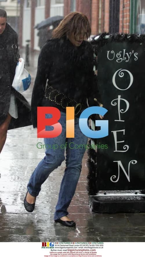 Jade Goody and Carly Walpole Brave Rain to Bank