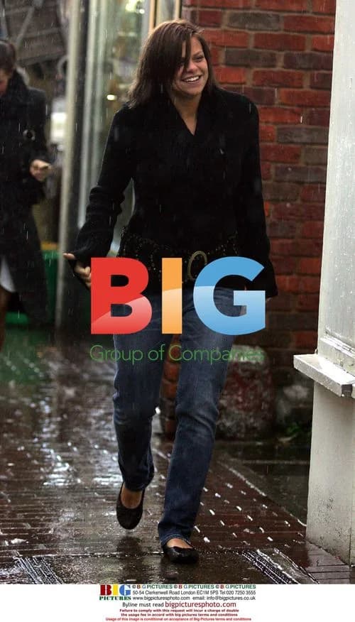 Jade Goody and Carly Walpole brave rain for bank visit
