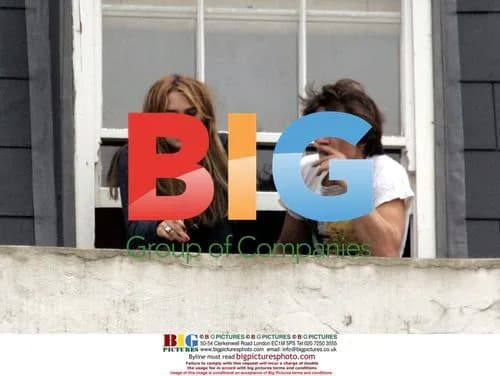 Keira Knightley and Friend Smoke on Balcony
