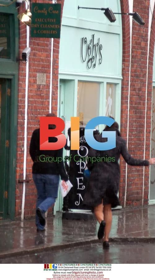 Jade Goody and Carly Walpole Brave Rain to Bank