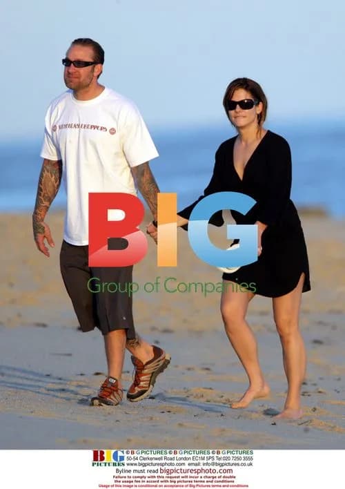 Sandra Bullock and Jesse James stroll on beach
