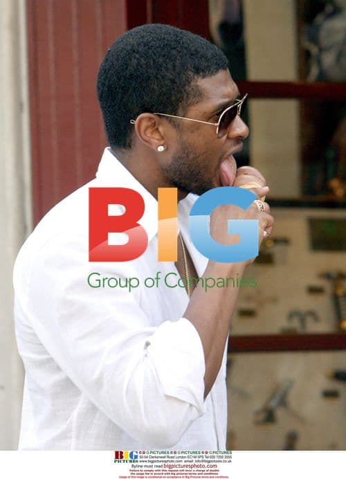 Usher goes shopping with girlfriend in St Barts