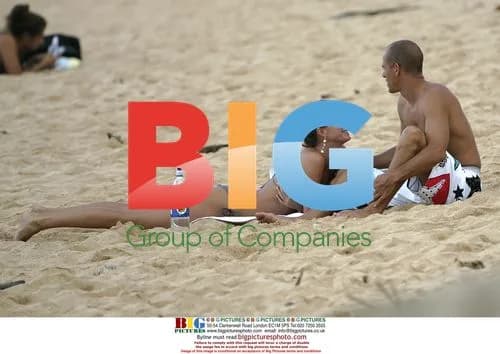 Gisele Bundchen and Kelly Slater at the beach