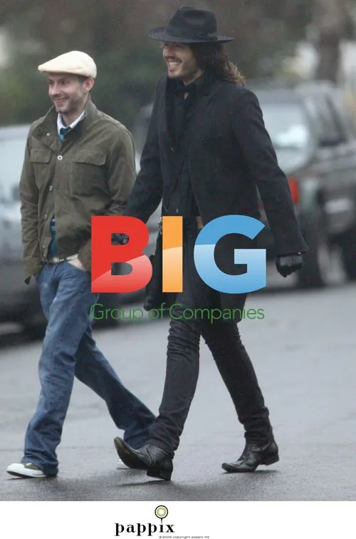 Russell Brand out in London rain