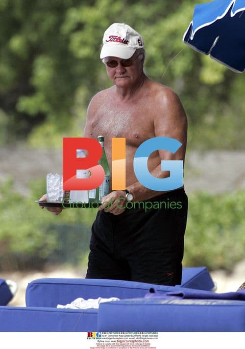 Ron Atkinson Relaxes on Barbados Beach
