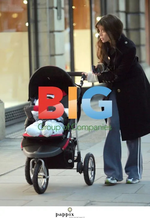Lisa Barbuscia strolls with baby in London